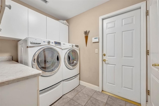 413 Harbour Oaks Pointe Dr, Edgewood, FL 32809 - laundry area featuring cabinet space, separate washer and dryer, and light tile patterned floors