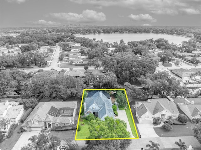 413 Harbour Oaks Pointe Dr, Edgewood, FL 32809 - aerial perspective of suburban area with a nearby body of water and property parcel outlined