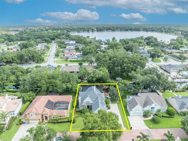 413 Harbour Oaks Pointe Dr, Edgewood, FL 32809 - aerial view of residential area with a nearby body of water and property parcel outlined