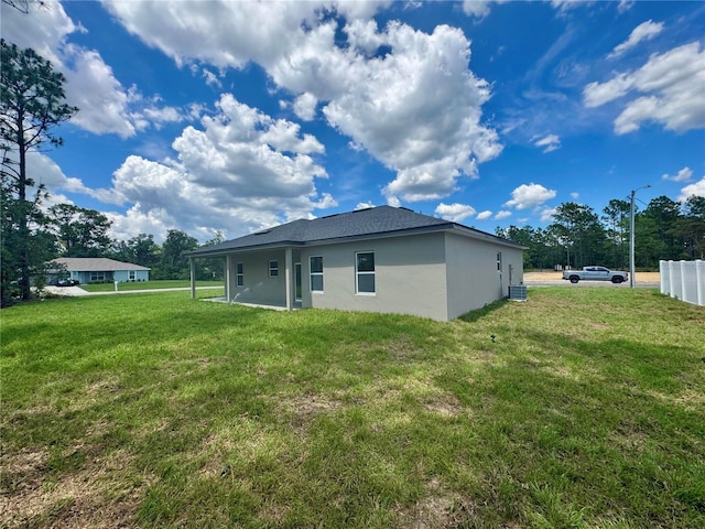 7215 N Westbrook Way, Citrus Springs, FL 34433 - rear view of property featuring stucco siding