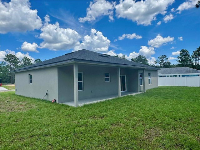 7215 N Westbrook Way, Citrus Springs, FL 34433 - rear view of property with stucco siding and a patio area