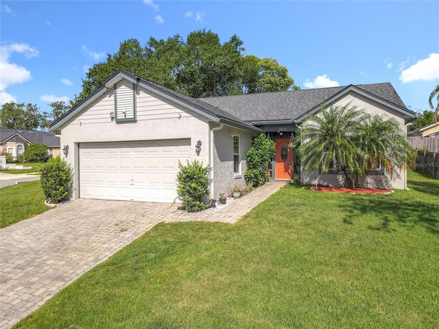 1044 Dees Dr, Oviedo, FL 32765 - ranch-style house with a garage, driveway, stucco siding, and a shingled roof