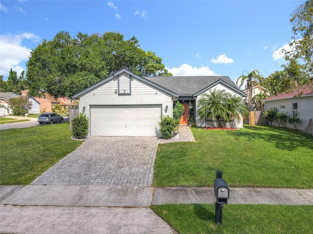 1044 Dees Dr, Oviedo, FL 32765 - ranch-style home with decorative driveway, a garage, and stucco siding