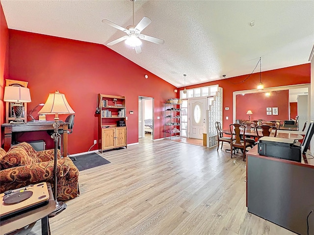 1044 Dees Dr, Oviedo, FL 32765 - living area with a ceiling fan, wood finished floors, lofted ceiling, and a textured ceiling