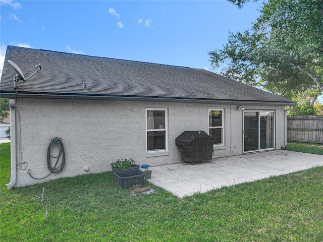 1044 Dees Dr, Oviedo, FL 32765 - back of house featuring stucco siding, roof with shingles, and a patio