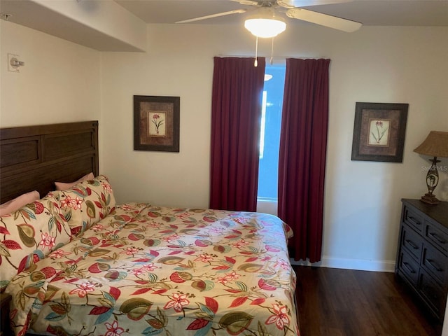 13415 Blue Heron Bch Unit 203, Orlando, FL 32821 - bedroom with dark wood-style flooring and a ceiling fan