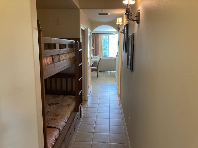 13415 Blue Heron Bch Unit 203, Orlando, FL 32821 - hall with tile patterned flooring and arched walkways