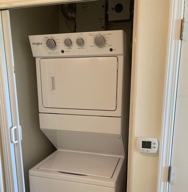 13415 Blue Heron Bch Unit 203, Orlando, FL 32821 - washroom featuring estacked washer and dryer