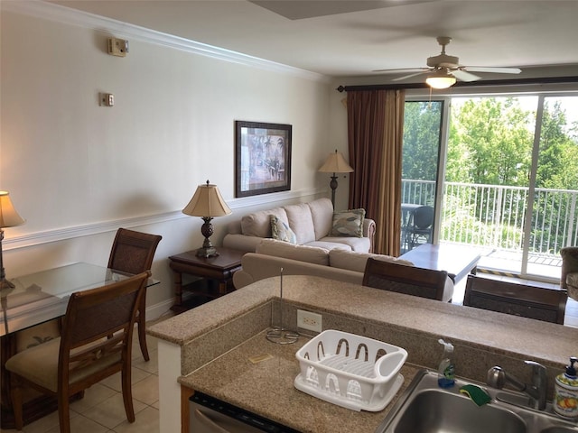 13415 Blue Heron Bch Unit 203, Orlando, FL 32821 - living area featuring light tile patterned flooring, ornamental molding, and ceiling fan