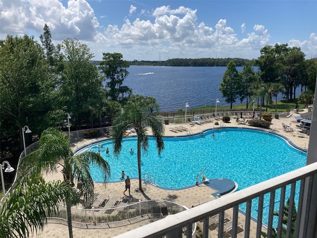 13415 Blue Heron Bch Unit 203, Orlando, FL 32821 - community pool featuring a patio and a water view