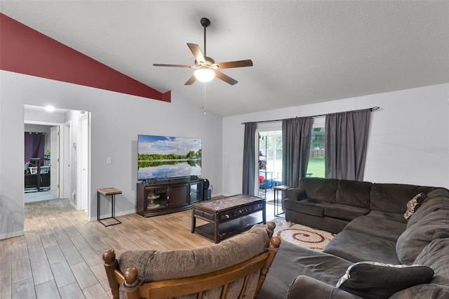 1113 Canopy Oaks Dr, Minneola, FL 34715 - living room with vaulted ceiling, a ceiling fan, and light wood finished floors