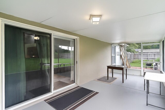 1113 Canopy Oaks Dr, Minneola, FL 34715 - unfurnished sunroom featuring healthy amount of natural light