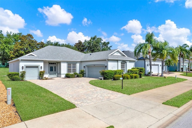 25105 Laurel Valley Rd, Leesburg, FL 34748 - ranch-style home featuring a garage, a front lawn, and decorative driveway