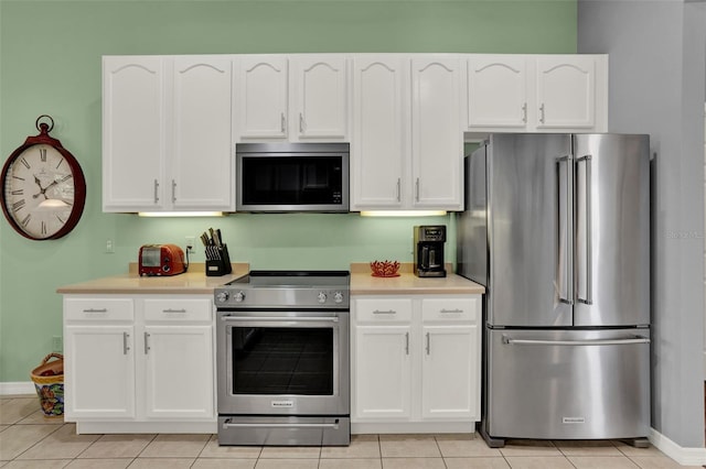 25105 Laurel Valley Rd, Leesburg, FL 34748 - kitchen featuring stainless steel appliances, white cabinetry, and light countertops
