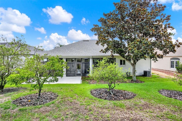 25105 Laurel Valley Rd, Leesburg, FL 34748 - back of house featuring a yard, a shingled roof, stucco siding, and a sunroom