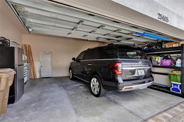 25105 Laurel Valley Rd, Leesburg, FL 34748 - garage with freestanding refrigerator