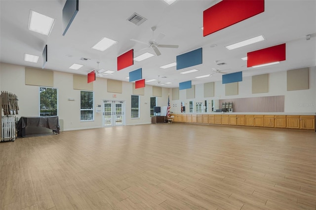 25105 Laurel Valley Rd, Leesburg, FL 34748 - exercise room with a high ceiling, a ceiling fan, and light wood finished floors