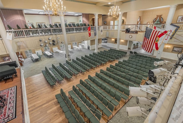 25105 Laurel Valley Rd, Leesburg, FL 34748 - interior space with decorative columns, wood finished floors, and a chandelier