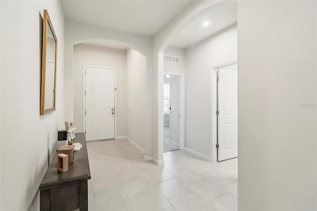 3142 Hill Point St, Minneola, FL 34715 - corridor with arched walkways and light tile patterned flooring