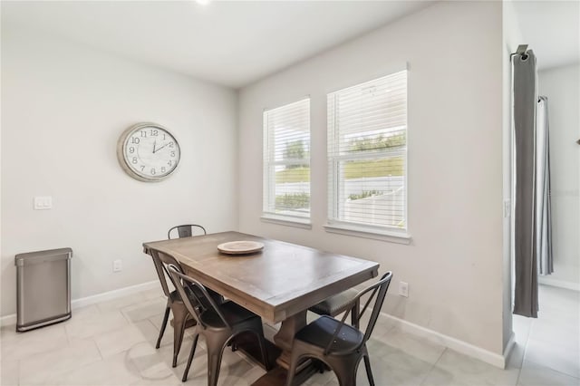 3142 Hill Point St, Minneola, FL 34715 - dining space with baseboards and light tile patterned flooring
