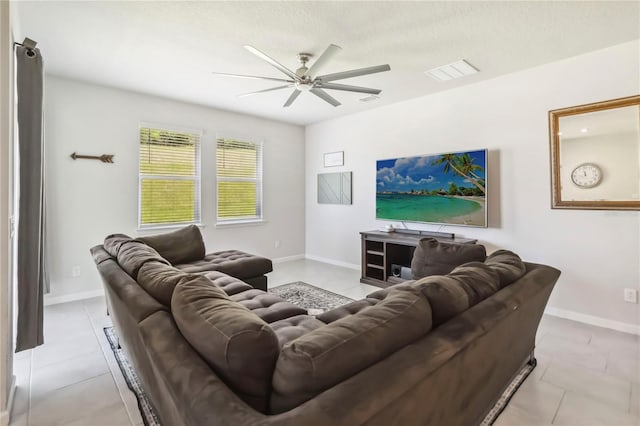 3142 Hill Point St, Minneola, FL 34715 - tiled living area with ceiling fan and baseboards