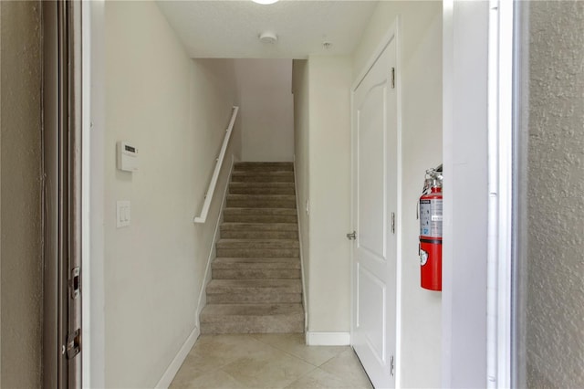 1269 Long Cove Loop Unit 1269, Davenport, FL 33896 - staircase with tile patterned floors and baseboards