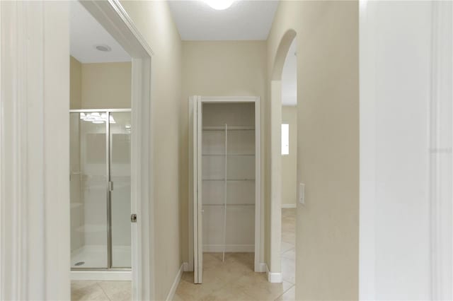 1269 Long Cove Loop Unit 1269, Davenport, FL 33896 - full bath with a stall shower, tile patterned flooring, and a spacious closet