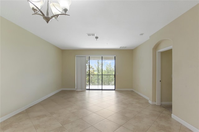 1269 Long Cove Loop Unit 1269, Davenport, FL 33896 - empty room with light tile patterned flooring, a chandelier, and arched walkways