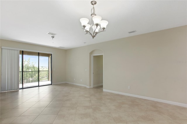 1269 Long Cove Loop Unit 1269, Davenport, FL 33896 - unfurnished room with a chandelier, arched walkways, and light tile patterned floors
