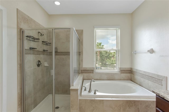 1269 Long Cove Loop Unit 1269, Davenport, FL 33896 - bathroom with a bath, a stall shower, and vanity