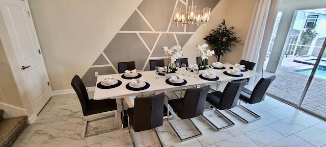 1201 Challenge Dr, Davenport, FL 33896 - dining area with marble look tiles and a chandelier