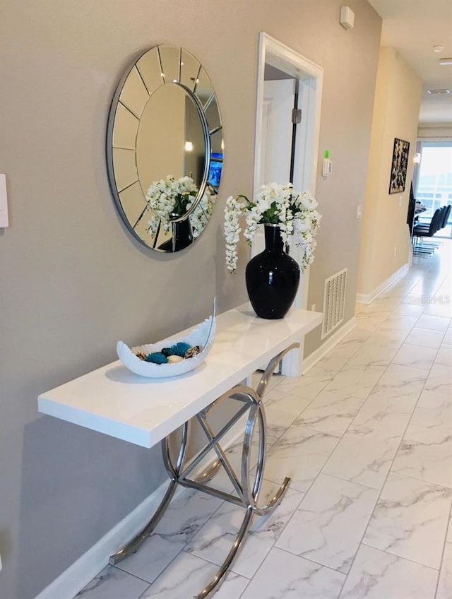 1201 Challenge Dr, Davenport, FL 33896 - hallway featuring baseboards and light marble finish floors