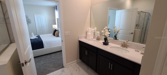 1201 Challenge Dr, Davenport, FL 33896 - ensuite bathroom with double vanity, marble finish floors, and a shower with shower door