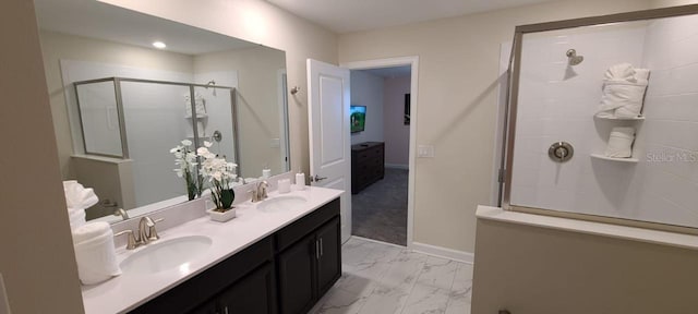 1201 Challenge Dr, Davenport, FL 33896 - bathroom featuring double vanity, an enclosed shower, marble finish floors, and connected bathroom