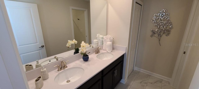 1201 Challenge Dr, Davenport, FL 33896 - full bathroom featuring marble look tiles and double vanity