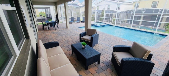 1201 Challenge Dr, Davenport, FL 33896 - view of swimming pool with an outdoor hangout area, a patio area, a pool with connected hot tub, and glass enclosure