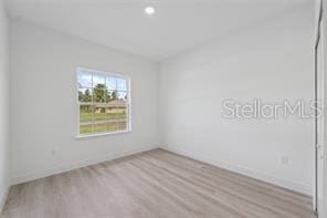 4572 SW 149th St, Ocala, FL 34473 - unfurnished room with wood finished floors and baseboards