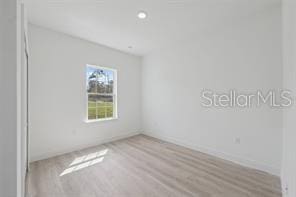 4572 SW 149th St, Ocala, FL 34473 - spare room with wood finished floors and recessed lighting