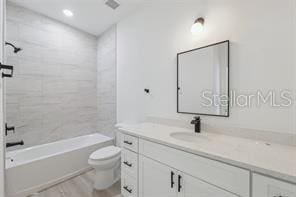 4572 SW 149th St, Ocala, FL 34473 - bathroom with vanity, shower / washtub combination, and wood finished floors