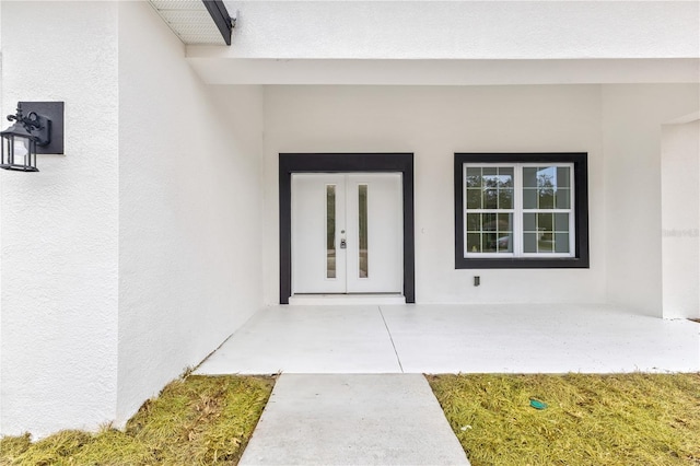 8790 N Elkcam Blvd, Citrus Springs, FL 34433 - property entrance featuring french doors and stucco siding
