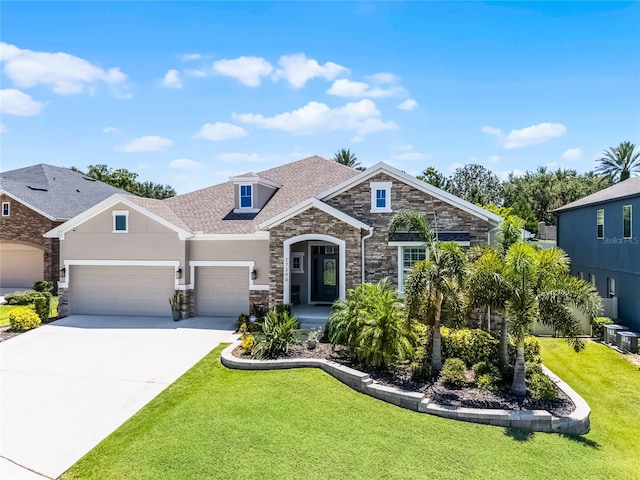 17290 Hickory Wind Dr, Clermont, FL 34711 - view of front of house featuring stone siding, a garage, a front lawn, concrete driveway, and stucco siding