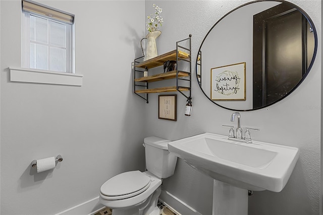 17290 Hickory Wind Dr, Clermont, FL 34711 - half bathroom with toilet and baseboards