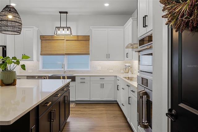 17290 Hickory Wind Dr, Clermont, FL 34711 - kitchen with recessed lighting, light countertops, white cabinetry, and tasteful backsplash
