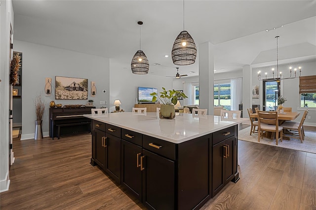 17290 Hickory Wind Dr, Clermont, FL 34711 - kitchen featuring open floor plan, a chandelier, dark wood finished floors, and plenty of natural light