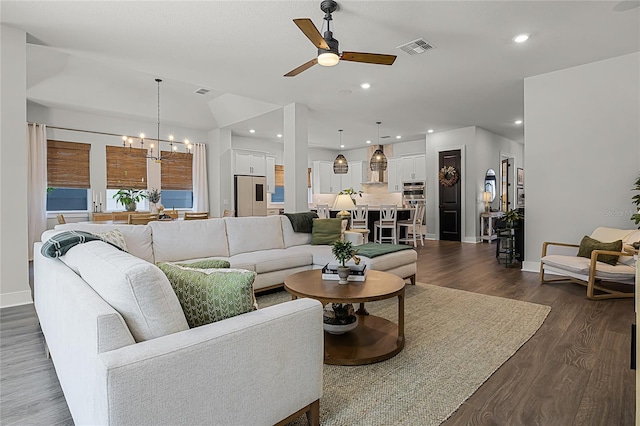 17290 Hickory Wind Dr, Clermont, FL 34711 - living area featuring dark wood-type flooring, a chandelier, a ceiling fan, and recessed lighting
