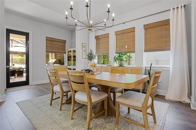 17290 Hickory Wind Dr, Clermont, FL 34711 - dining space with a chandelier and wood finished floors