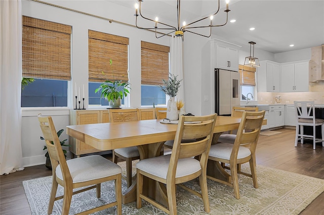17290 Hickory Wind Dr, Clermont, FL 34711 - dining space featuring wood finished floors, recessed lighting, and a chandelier