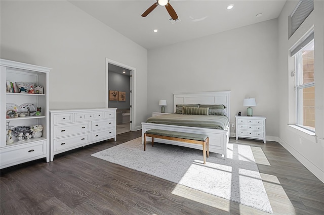 17290 Hickory Wind Dr, Clermont, FL 34711 - bedroom with dark wood finished floors, multiple windows, recessed lighting, a ceiling fan, and connected bathroom