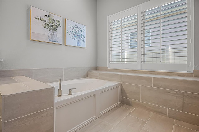 17290 Hickory Wind Dr, Clermont, FL 34711 - full bathroom featuring tile patterned floors, a bath, and tile walls