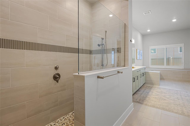 17290 Hickory Wind Dr, Clermont, FL 34711 - full bath with a walk in shower, tile patterned floors, vanity, recessed lighting, and a tub to relax in